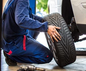 Mechanic Changing a Car Wheel