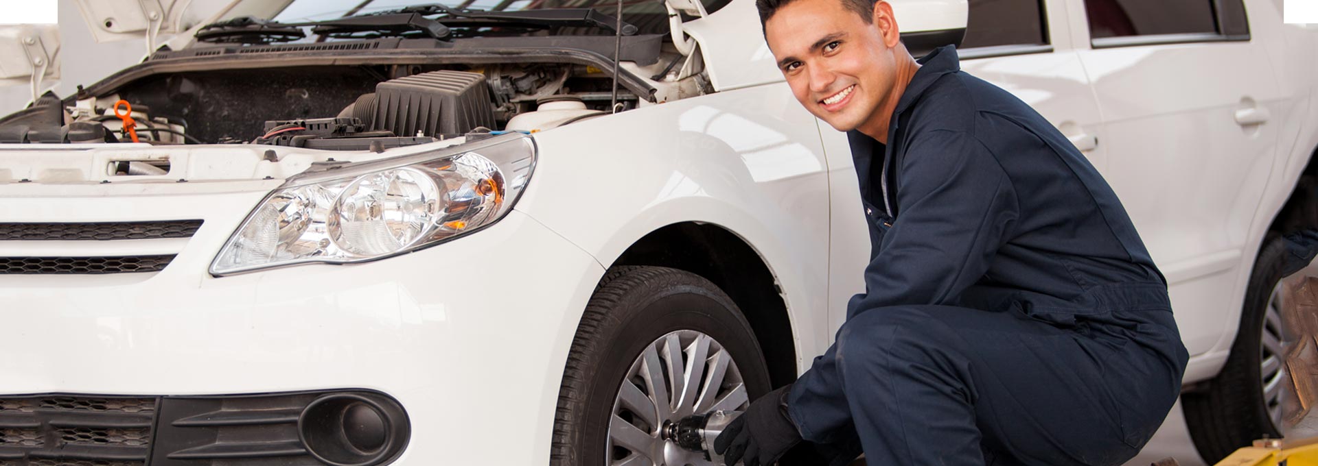 Auto Mechanic Changing Car Wheel