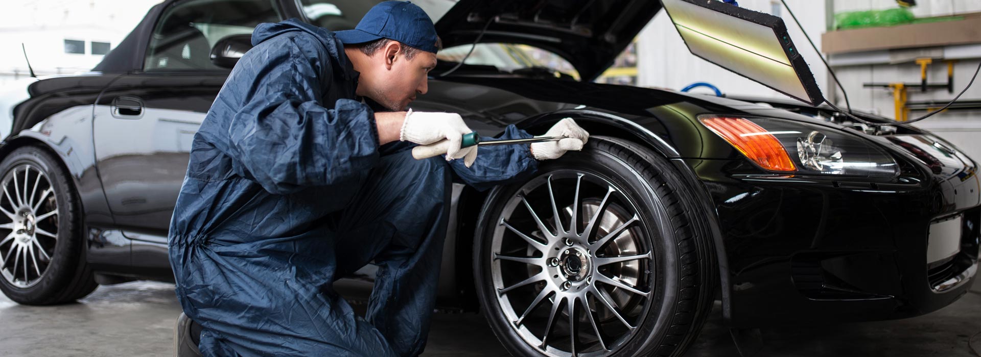 Auto Mechanic Working in Garage